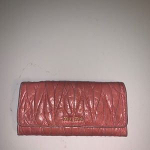 Mui Mui Matelasse long flap wallet in light pink